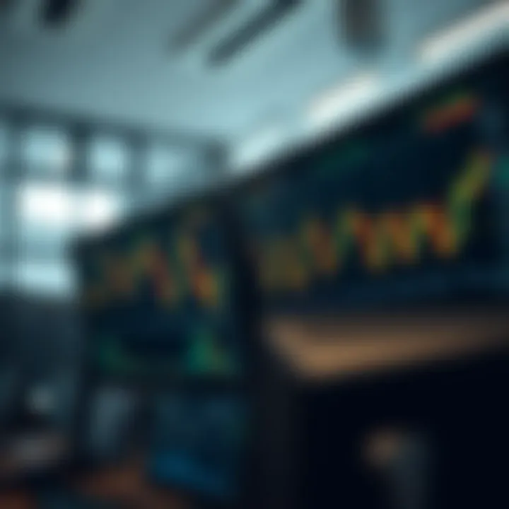 Graph showing fluctuating currency exchange rates on multiple monitors